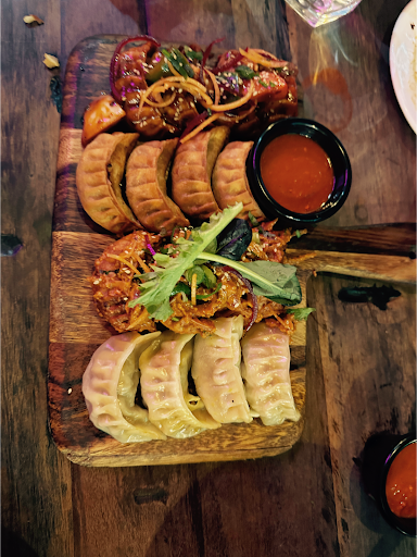Mixed momo platter on a wooden board