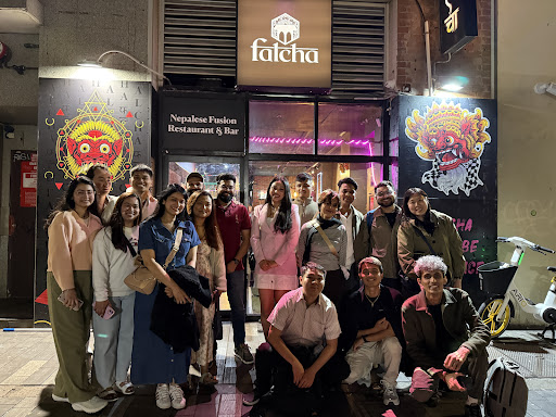 Falcha Town Hall storefront with guests outside